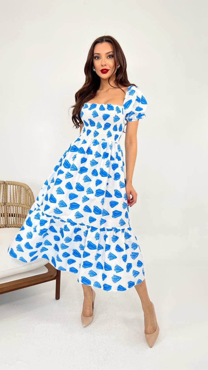 An image showcasing a White Blue vibrant cotton summer dress with a relaxed fit and airy fabric, perfect for warm weather outings and beachside adventures