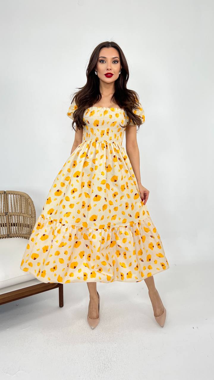 Image of a white yellow summer cotton dress in a vibrant shade, featuring a relaxed silhouette and breathable fabric, perfect for warm weather occasions.