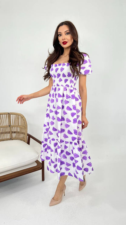 Image of a white move summer cotton dress in a vibrant shade, featuring a relaxed silhouette and breathable fabric, perfect for warm weather occasions.