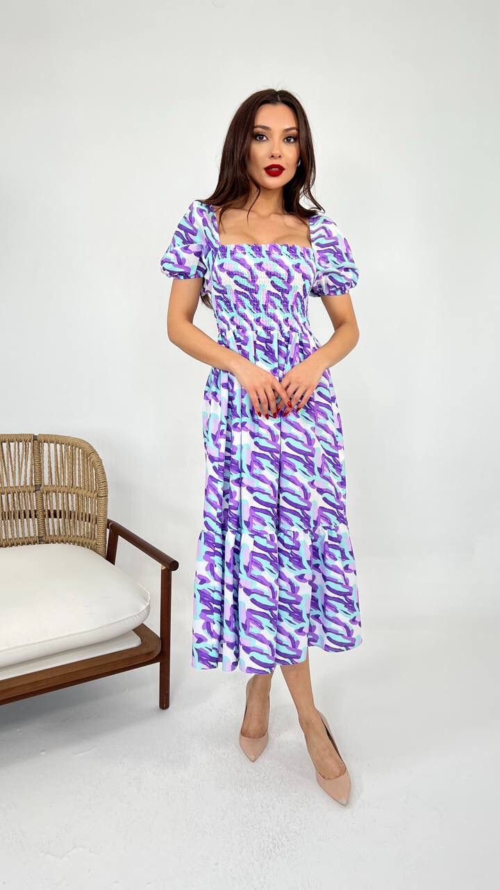 An image showcasing a white blue Mauve vibrant cotton summer dress with a relaxed fit and airy fabric, perfect for warm weather outings and beachside adventures