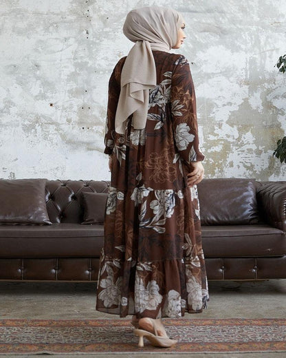 brown chiffon long dress, a graceful ensemble designed to captivate with its ethereal beauty and feminine allure. Crafted from delicate chiffon fabric, this dress embodies elegance and sophistication, making it a perfect choice for special occasions or formal events.